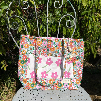 Sac cabas Cousine Antoinette Chéribibi, sac en toile avec poignées en cuir, design élégant et pratique pour la journée.